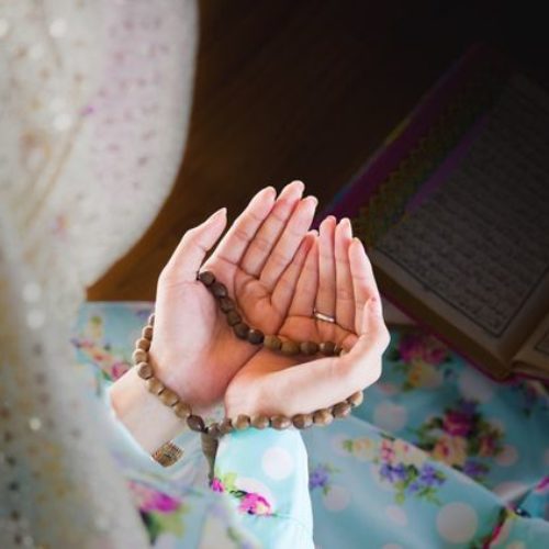 young muslim woman praying for Allah, muslim God